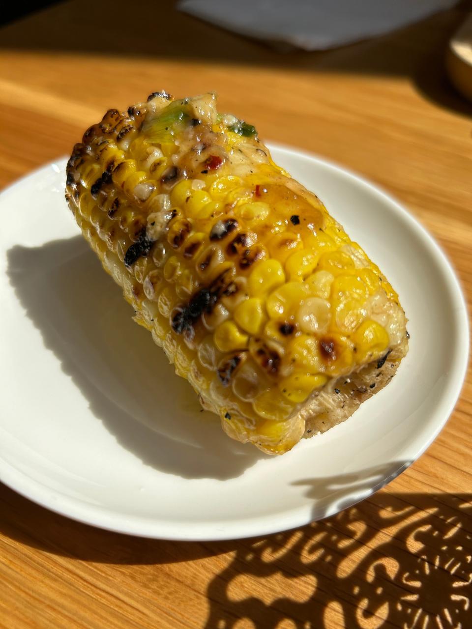 Roasted street corn with parmesan cheese at SRINA Tea House & Cafe.