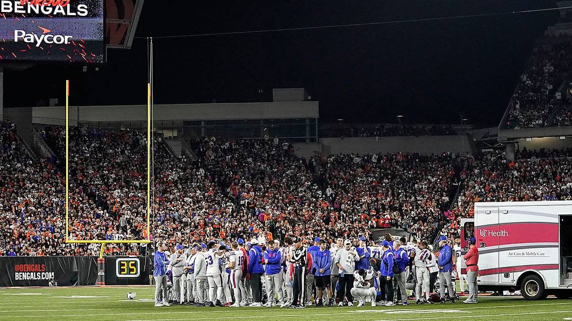 Buffalo Bills players pray for teammate Damar Hamlin during the first half of an NFL football game against the Cincinnati Bengals, Monday, Jan. 2, 2023, in Cincinnati.