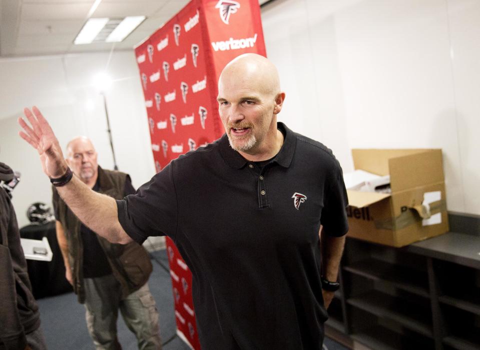 Atlanta Falcons head coach Dan Quinn leaves a press conference at the football team's practice facility in Flowery Branch, Ga., Monday, Jan. 23, 2017. The Falcons will play the New England Patriots in the Super Bowl on Sunday Feb. 5. (AP Photo/David Goldman)