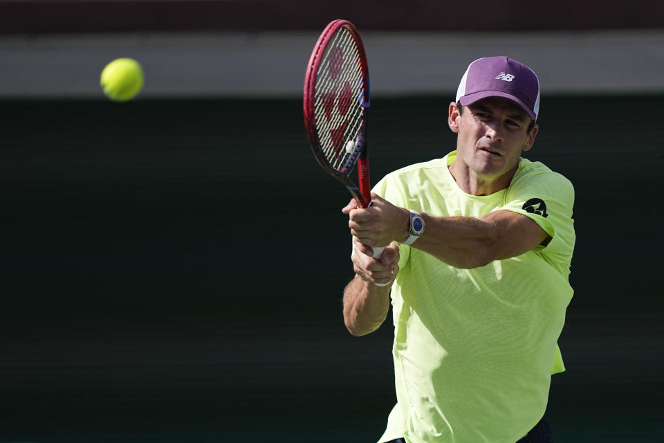 Tommy Paul, of the United States, returns to Luca Nardi, of Italy, at the BNP Paribas Open tennis tournament, Wednesday, March 13, 2024, in Indian Wells, Calif. (AP Photo/Mark J. Terrill)