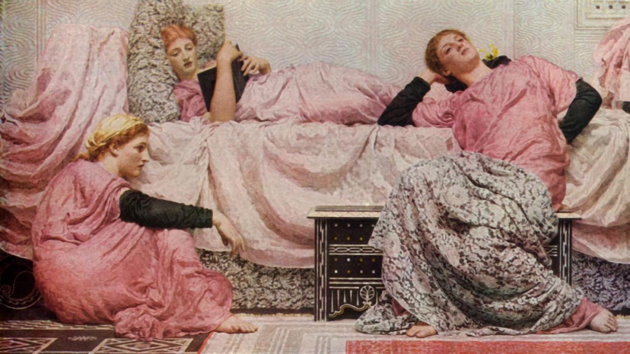 three girls lounging and reading