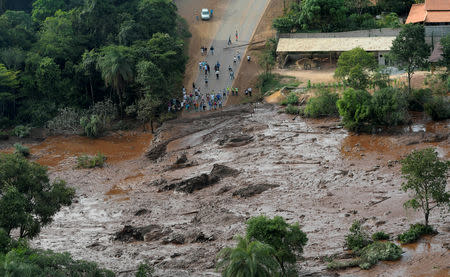 FILE PHOTO: Residents are seen in an area next to a dam owned by Brazilian miner Vale SA that burst, in Brumadinho, Brazil January 25, 2019. REUTERS/Washington Alves/File photo