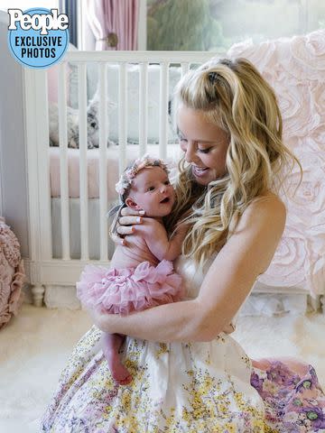 <p>Jenny Quicksall Photography</p> Tara Lipinski and baby Georgie