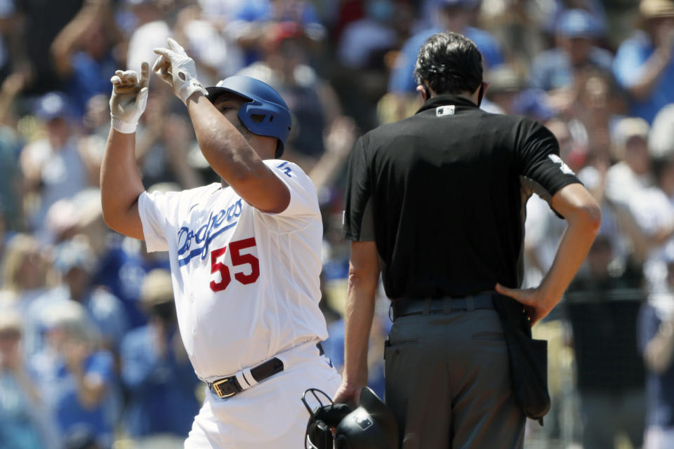 Los Angeles Dodgers' Albert Pujols celebrates at the plate after hitting a two-run home run against the Los Angeles Angels during the second inning of a baseball game in Los Angeles, Sunday, Aug. 8, 2021. (AP Photo/Alex Gallardo)