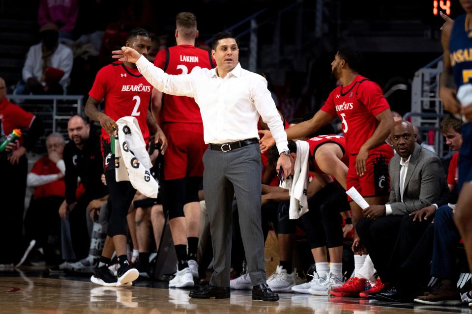 Cincinnati head coach Wes Miller communicates with his players in the first half vs. La Salle, Saturday, Dec. 17, 2022.