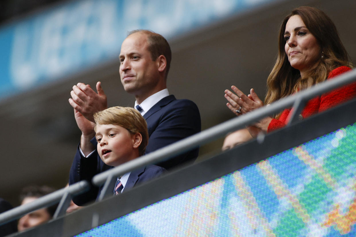 Prince William, pictured with wife Kate and son George at a UEFA EURO 2020 match in London on 29 June 2021, has spoken about his son's understanding of climate change. (Getty Images)