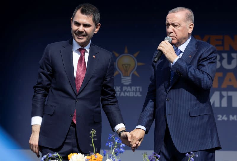 Turkey's President Erdogan and Murat Kurum greet their supporters during a rally in Istanbul