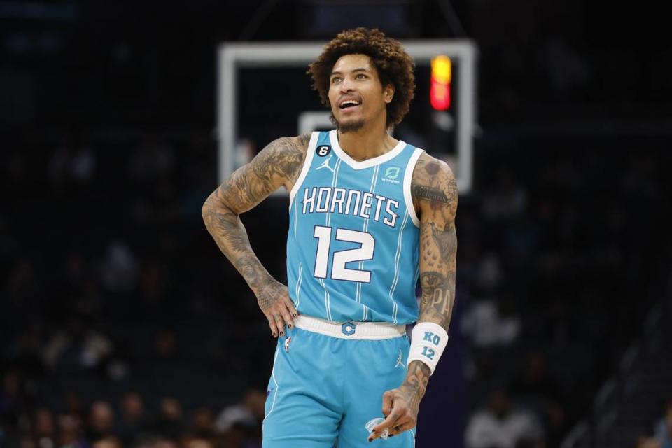 Mar 20, 2023; Charlotte, North Carolina, USA; Charlotte Hornets guard Kelly Oubre Jr. (12) stands on the court during a break in the action against the Indiana Pacers during the second half at Spectrum Center. The Charlotte Hornets won 115-109. Mandatory Credit: Nell Redmond-USA TODAY Sports