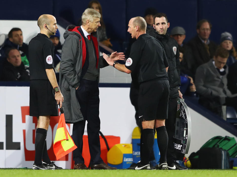 Arsene Wenger confronts Mike Dean during Arsenal's 1-1 draw with West Brom: Getty