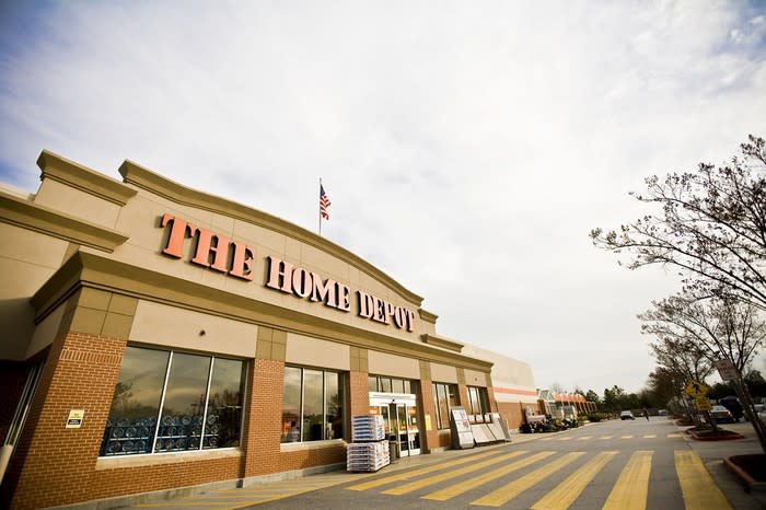 Home Depot store as seen from parking lot, with trees nearby.