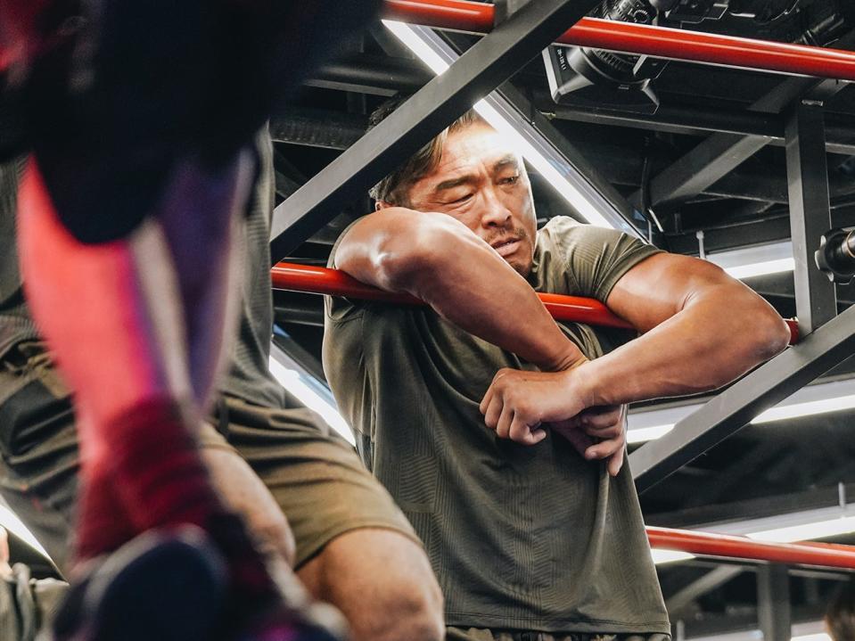 MMA fighter Choo Sung-soon hanging on a metal structure