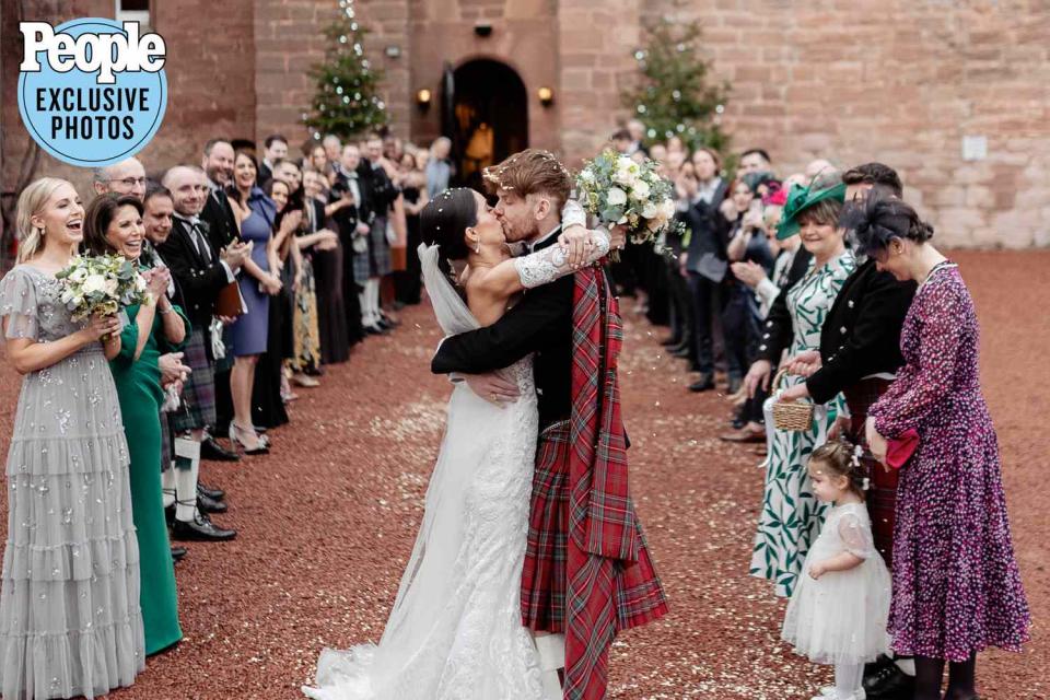 <p>Ricky Baillie, @rickybailliephotography</p> Country singer Jordan Harvey and Madison Fendley share a kiss on their wedding day