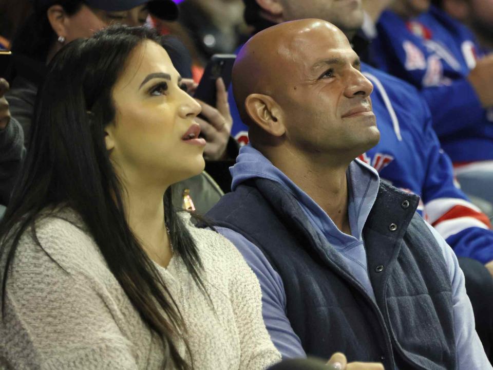 <p>Bruce Bennett/Getty</p> Robert Saleh and his wife Sanaa watch a New York Rangers game against the New York Islanders in 2022