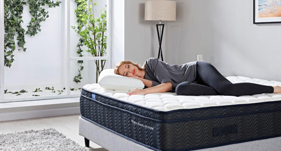 Woman lying on mattress