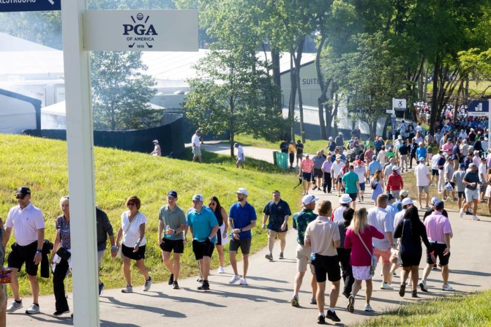 Fans follow players around the course during Thursday’s opening round of the PGA Championship at Valhalla Golf Course in Louisville. The start of the second round was delayed when a pedestrian reportedly died after being hit by a tournament shuttle Friday morning.