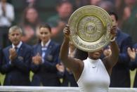 Britain Tennis - Wimbledon - All England Lawn Tennis & Croquet Club, Wimbledon, England - 9/7/16 USA's Serena Williams celebrates winning her womens singles final match against Germany's Angelique Kerber with the trophy REUTERS/Toby Melville