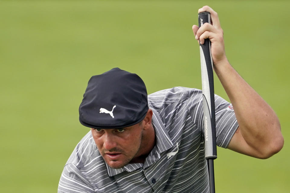 FILE - In this Aug. 20, 2021, file photo, Bryson DeChambeau lines up his shot on the 12th green during the second round of the Northern Trust golf tournament at Liberty National Golf Course in Jersey City, N.J. When DeChambeau arrives at Whistling Straits for the Ryder Cup the 6-foot-1, 235-pound disrupter with a world-leading driving average of 323.7 yards, will bring with him an epic amount of baggage. He is in the middle of a months-long feud with one of his teammates, Brooks Koepka, who happens to have three more major titles than DeChambeau. (AP Photo/John Minchillo, File)