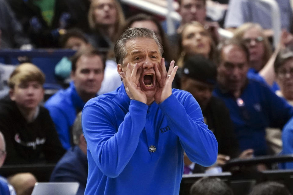 Kentucky head coach John Calipari shouts to his players on the court during the second half of a first-round college basketball game against Providenc in the NCAA Tournament on Friday, March 17, 2023, in Greensboro, N.C. (AP Photo/John Bazemore)