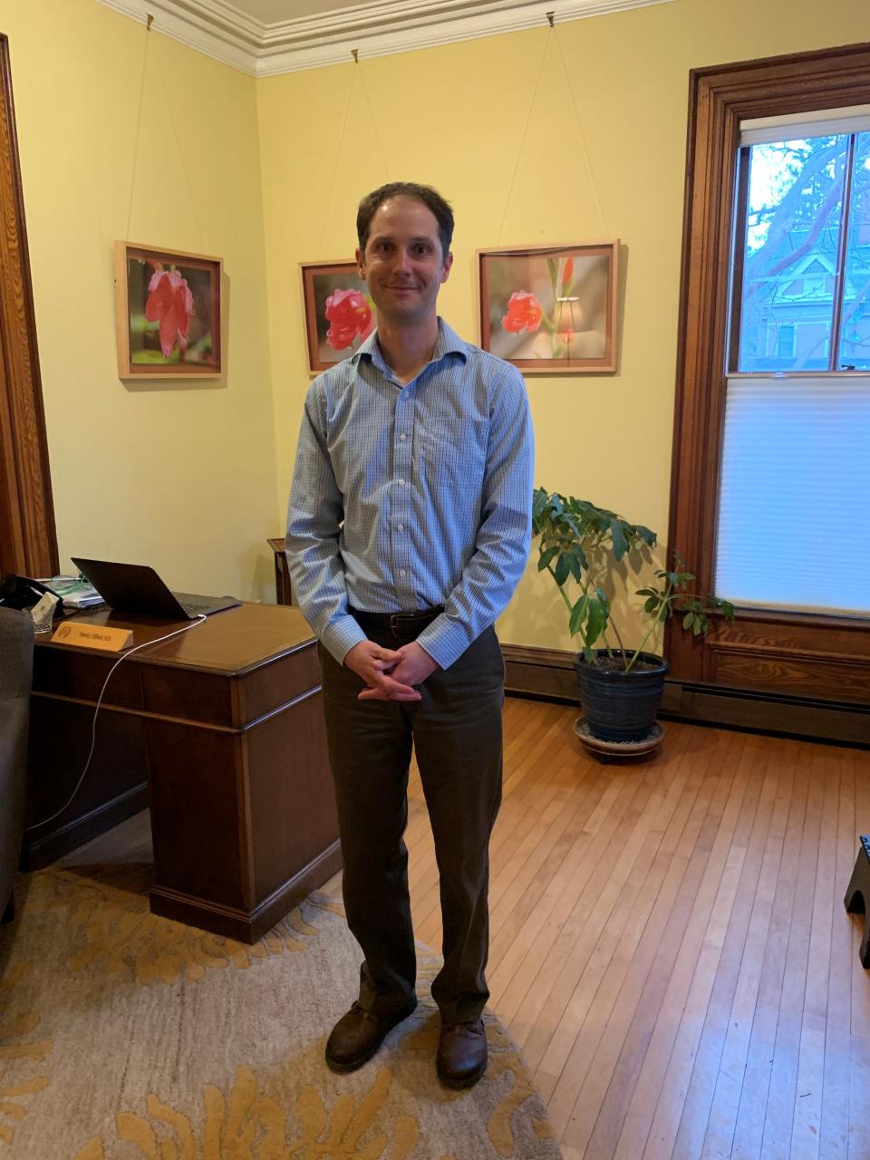 Travis Elliott at his office in Shelburne, Vermont, where he offers a test guiding treatment with a single drop of blood.