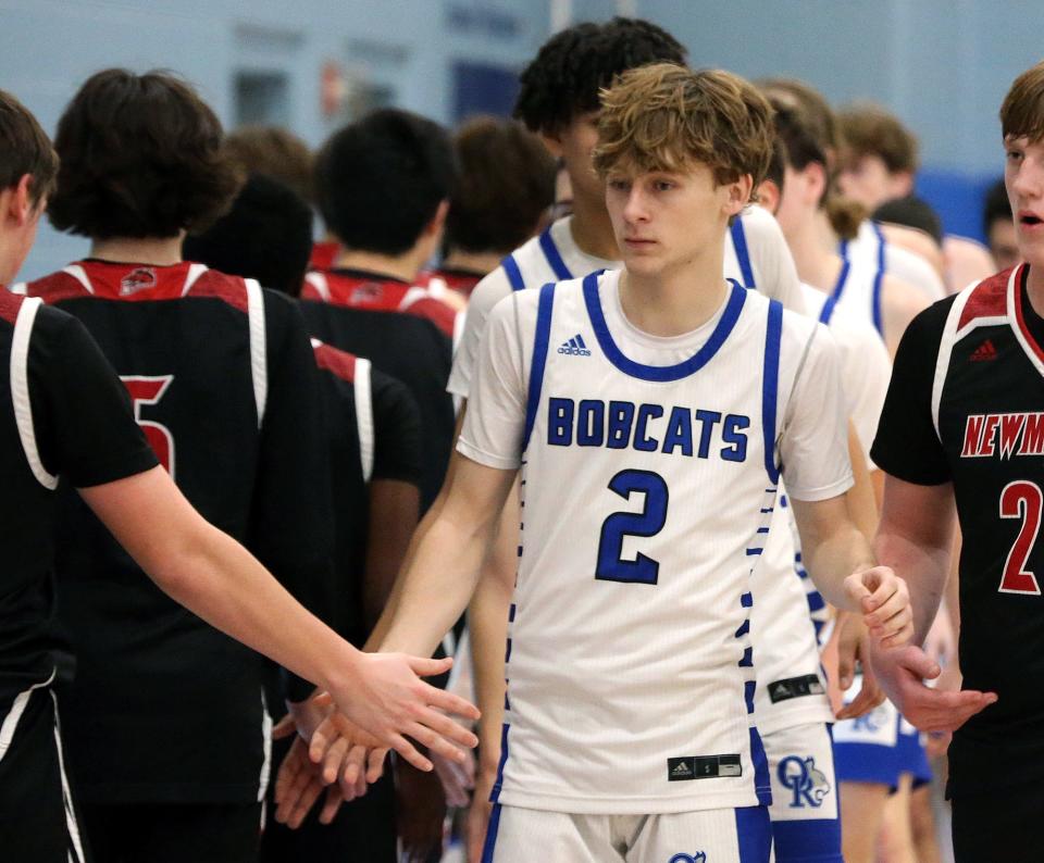 Oyster River's Ethan shakes hands with Newmarket players after they beat the Mules in the 12 Annual Bobcat Holiday Classic Dec. 26, 2023.