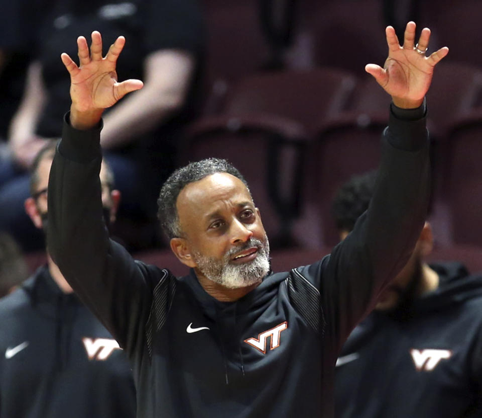 Virginia Tech head coach Kenny Brooks signals from the bench against Coppin State during in the first half of an NCAA college basketball game in Blacksburg Va., Wednesday, Nov. 17 2021. (Matt Gentry/The Roanoke Times via AP)