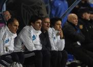 Real Madrid's Portuguese coach Jose Mourinho (2nd R) reacts during their Spanish league football match against Malaga at the Rosaleda stadium in Malaga on December 22, 2012. Mourinho was under renewed pressure on Saturday after his team lost 3-2 at Malaga, a defeat which left the champions 16 points behind leaders Barcelona