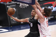 Sacramento Kings guard Tyrese Haliburton (0) goes to the basket against Washington Wizards center Robin Lopez (15) during the second half of an NBA basketball game, Wednesday, March 17, 2021, in Washington. (AP Photo/Nick Wass)