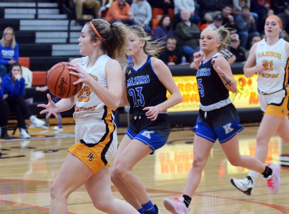 Hailey Fisher (far left) and the rest of the Harbor Springs girls got back to LMC play Thursday and rolled Kalkaska.