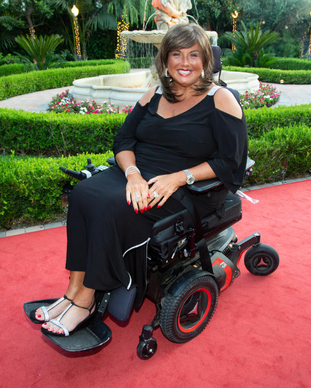 Why is Abby Lee Miller using a wheelchair?