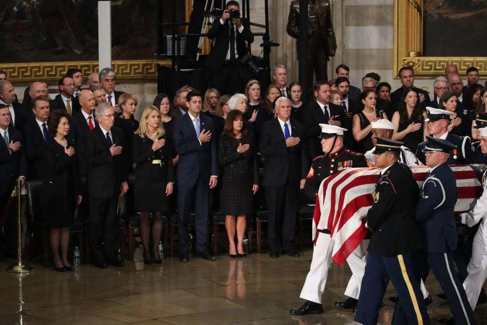 23) John McCain's casket enters the rotunda.