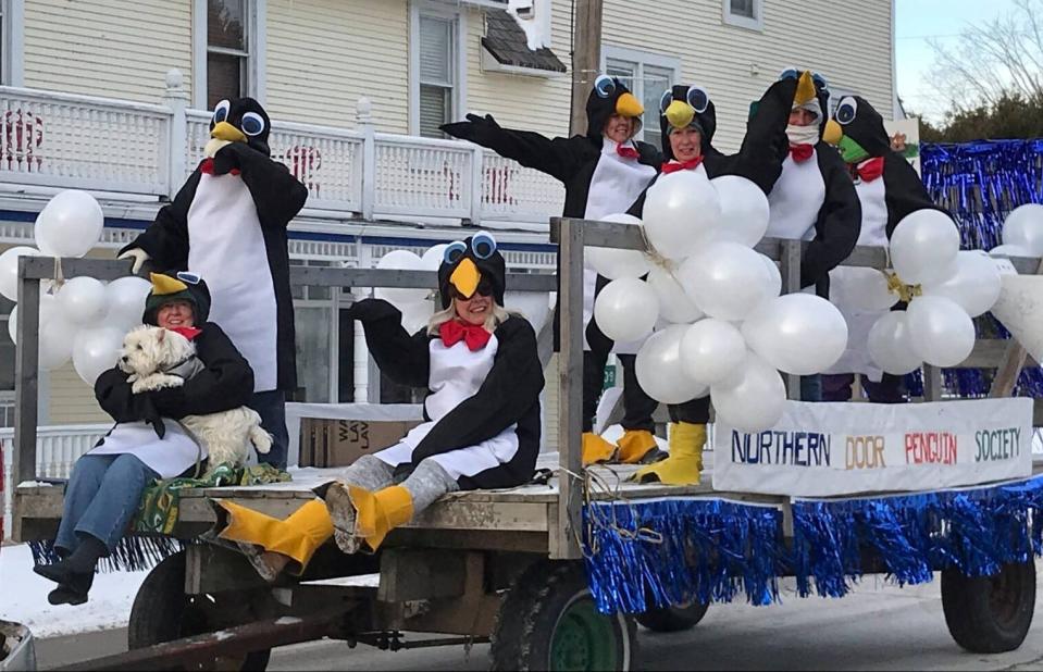 The Northern Door Penguin Society rides through Ellison Bay in a previous Groundhog Day Parade, which returns from a hiatus to march through the community Feb. 2.