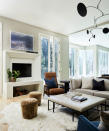 <p> Whether you want to upgrade your traditional fireplace ideas, or are installing a new fireplace into a modern property for your family room ideas with fireplaces, choosing a contemporary design can make a real statement in a space.  </p> <p> In this family room by Alice Lane Interior Design, the bespoke fireplace is defined by a unique, framed design.  </p> <p> Alice Lane states, 'the design of the family room began with the fireplace design and rug selection. The client loves cozying up around the fireplace during the cold winters and wanted to incorporate storage for the cut logs.' </p> <p> The rectangular, white paneled frame makes for a truly contemporary feature, with the large, blocked design matching the style and proportions of the family room. </p>