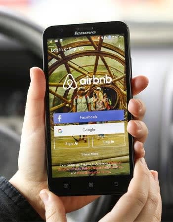 A close up of a smartphone screen with the AirBnb app open.