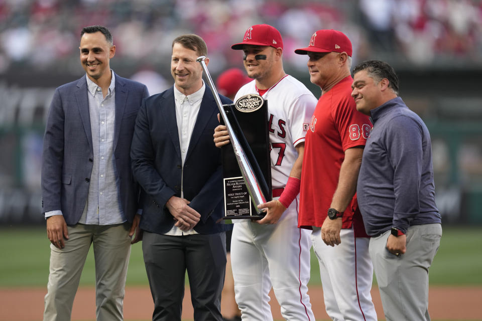 Los Angeles Angels' Mike Trout (27) is presented with the Sliver Slugger Award before a baseball game against the Kansas City Royals in Anaheim, Calif., Saturday, April 22, 2023. (AP Photo/Ashley Landis)