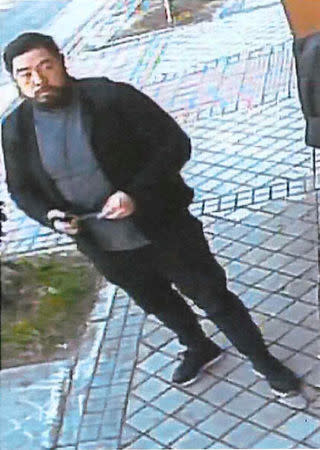 Former U.S. Marine Christopher Philip Ahn is allegedly shown in a still photo from a surveillance camera standing in front of the North Koria embassy in Madrid, Spain, February 22, 2019. U.S. Attorney's Office Central District of California/Handout via REUTERS