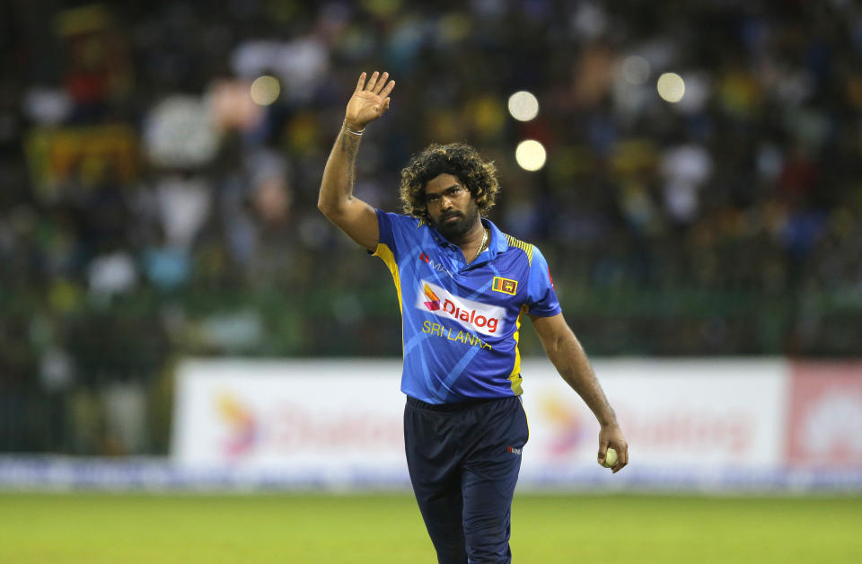 Sri Lanka's bowler Lasith Malinga who played his career last one-day international cricket match acknowledges the crowd after Sri Lanka defeated Bangladesh by 91 runs in the first one-day international cricket match between Sri Lanka and Bangladesh in Colombo, Sri Lanka, Friday, July 26, 2019. (AP Photo/Eranga Jayawardena)