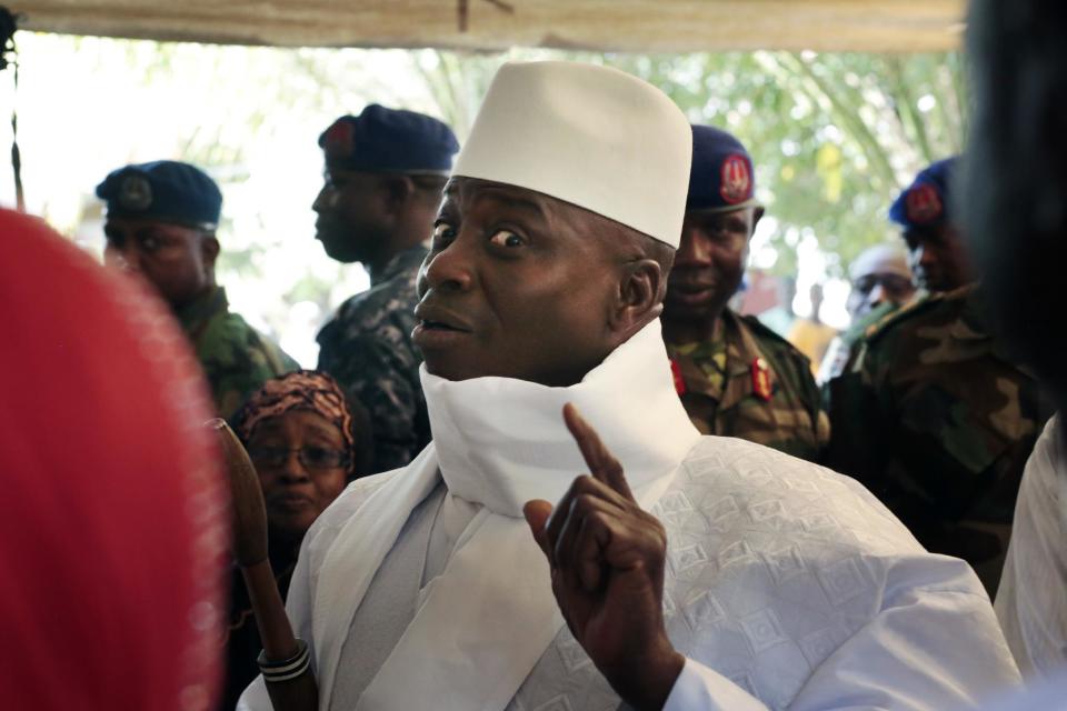 In a Thursday, Dec. 1, 2016 file photo, Gambia's president Yahya Jammeh shows his inked finger before voting in Banjul, Gambia. Gambia's ruler of more than 22 years now says he won't accept defeat in the presidential election, reversing course a week after he conceded defeat. In a speech on state television aired late Friday, Dec. 9, 2016,, President Yahya Jammeh said that investigations had revealed voting irregularities that he called unacceptable. (AP Photo/Jerome Delay)