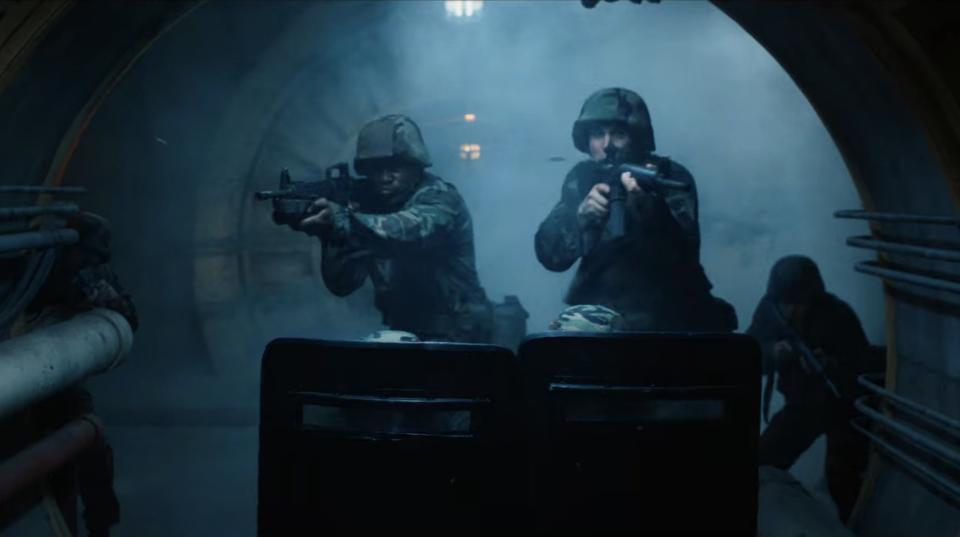 U.S. military soldiers firing guns inside the Nina Project in "Stranger Things"