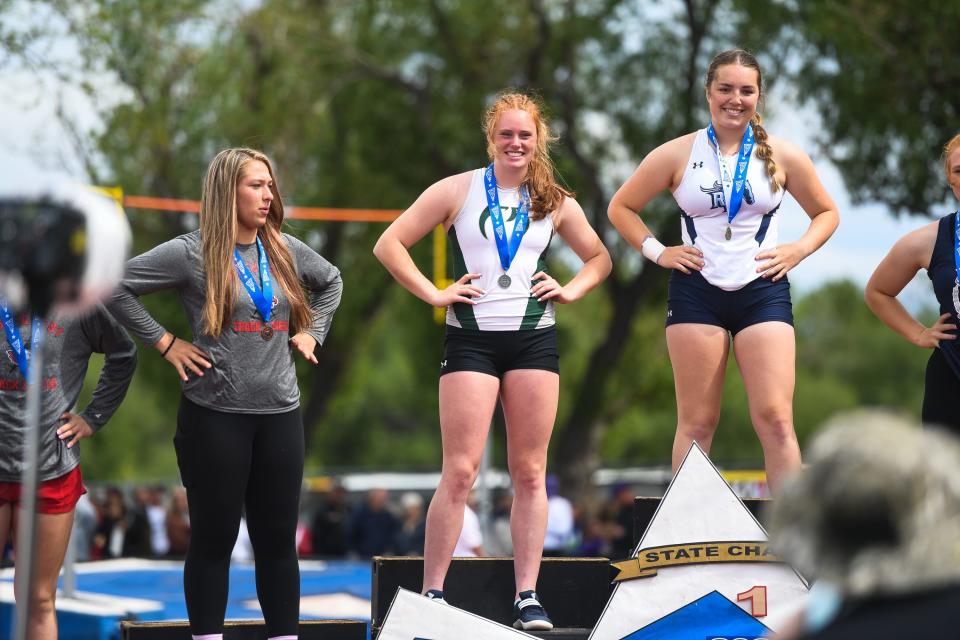 Fossil Ridge's Erin Herrmann takes a photo on the podium at the Colorado high school track and field state meet at Jeffco Stadium on Thursday, May 18, 2023, in Lakewood, Colo. Herrmann took second in the Class 5A girls shot put.