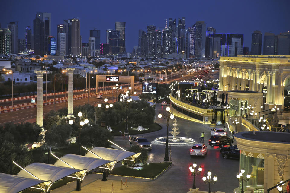 FILE - With a general view of skyline, cars arrive at the Al Hazm luxury mall, in Doha, Qatar, Wednesday, April 24, 2019. A recent outpouring of local anger to scenes of foreign artists and models reveling in Qatar underscored the tensions tearing at the conservative Muslim emirate. (AP Photo/Kamran Jebreili, File)