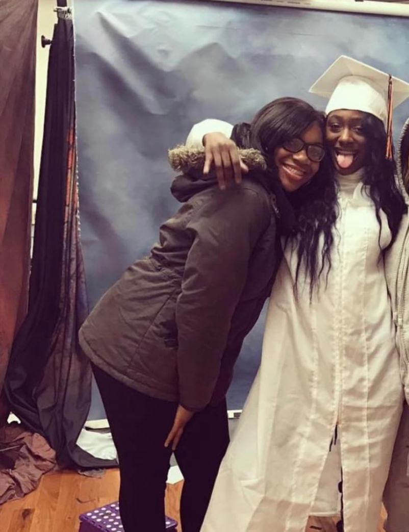 Alontia Moore (left) and Lauren Smith-Fields posing during Smith-Fields' high school graduation pictures.