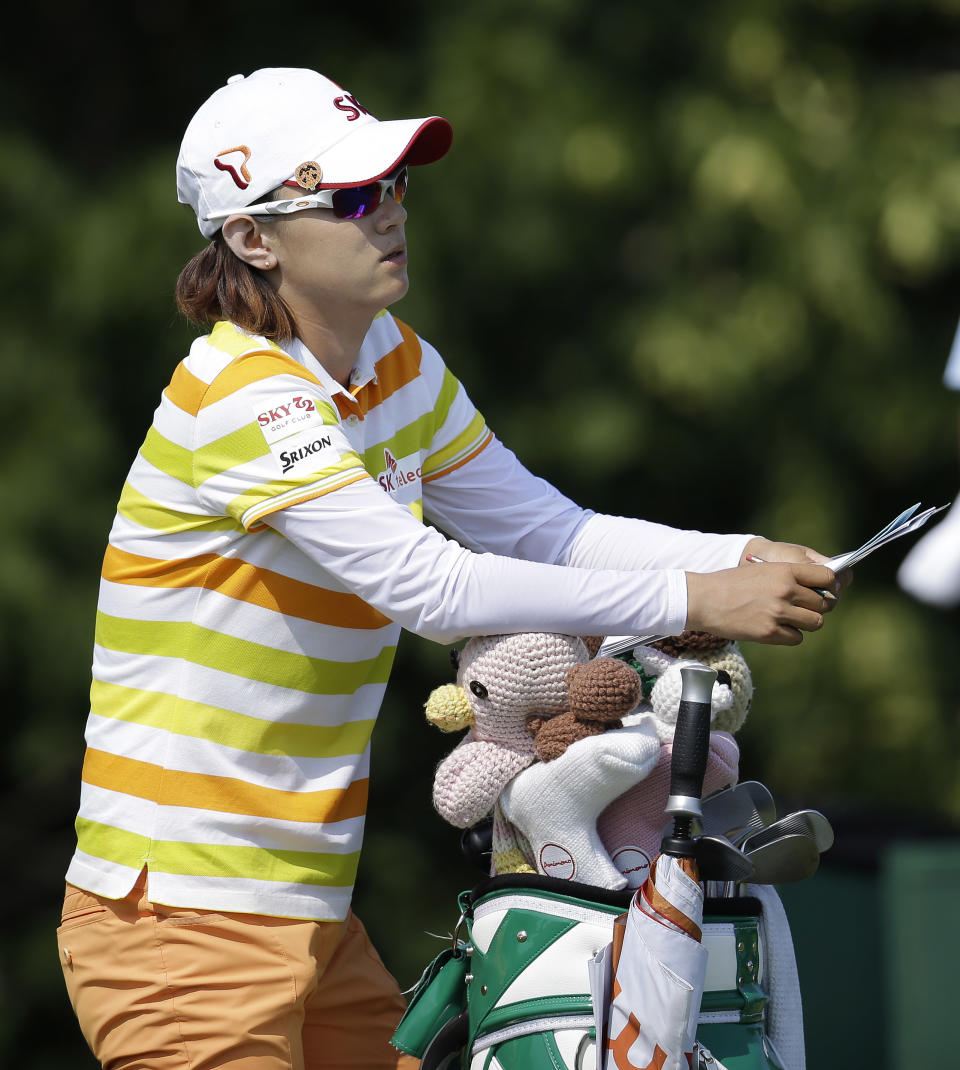 Na Yeon Choi, of South Korea, checks her notes before teeing off the sixth hole during the first round of the U.S. Women's Open golf tournament, Thursday, July 5, 2012, in Kohler, Wis. (AP Photo/Julie Jacobson)