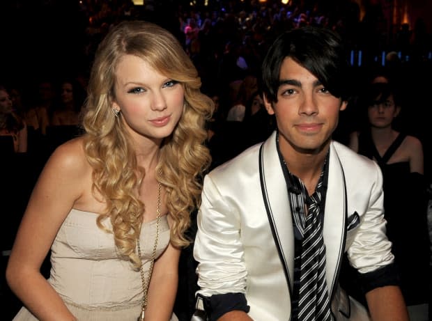 <p> Talk about a throwback! Taylor Swift and <strong><a href="https://parade.com/tag/jonas-brothers" rel="nofollow noopener" target="_blank" data-ylk="slk:Joe Jonas;elm:context_link;itc:0;sec:content-canvas" class="link ">Joe Jonas</a> </strong>cozy up at the MTV VMAs on Sept. 7, 2008. Swift would later reveal that Jonas dumped her in a 27-second phone call, but they eventually buried the hatchet and became friends.</p><p>Jeff Kravitz/FilmMagic</p>