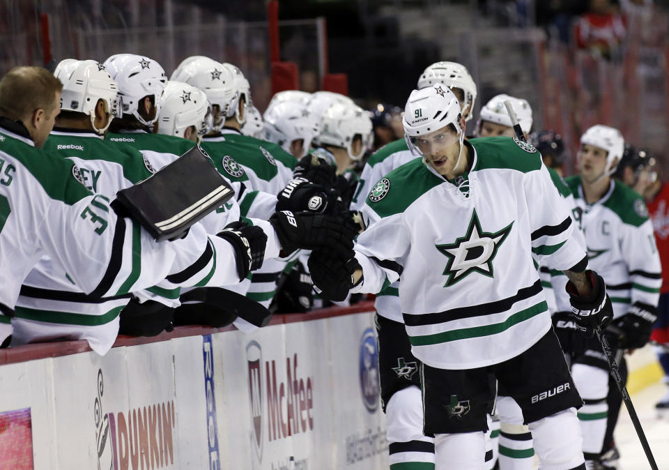 Dallas Stars center Tyler Seguin, right, celebrates his goal with his teammates in the first period of an NHL hockey game against the Washington Capitals, Tuesday, April 1, 2014, in Washington. (AP Photo/Alex Brandon)