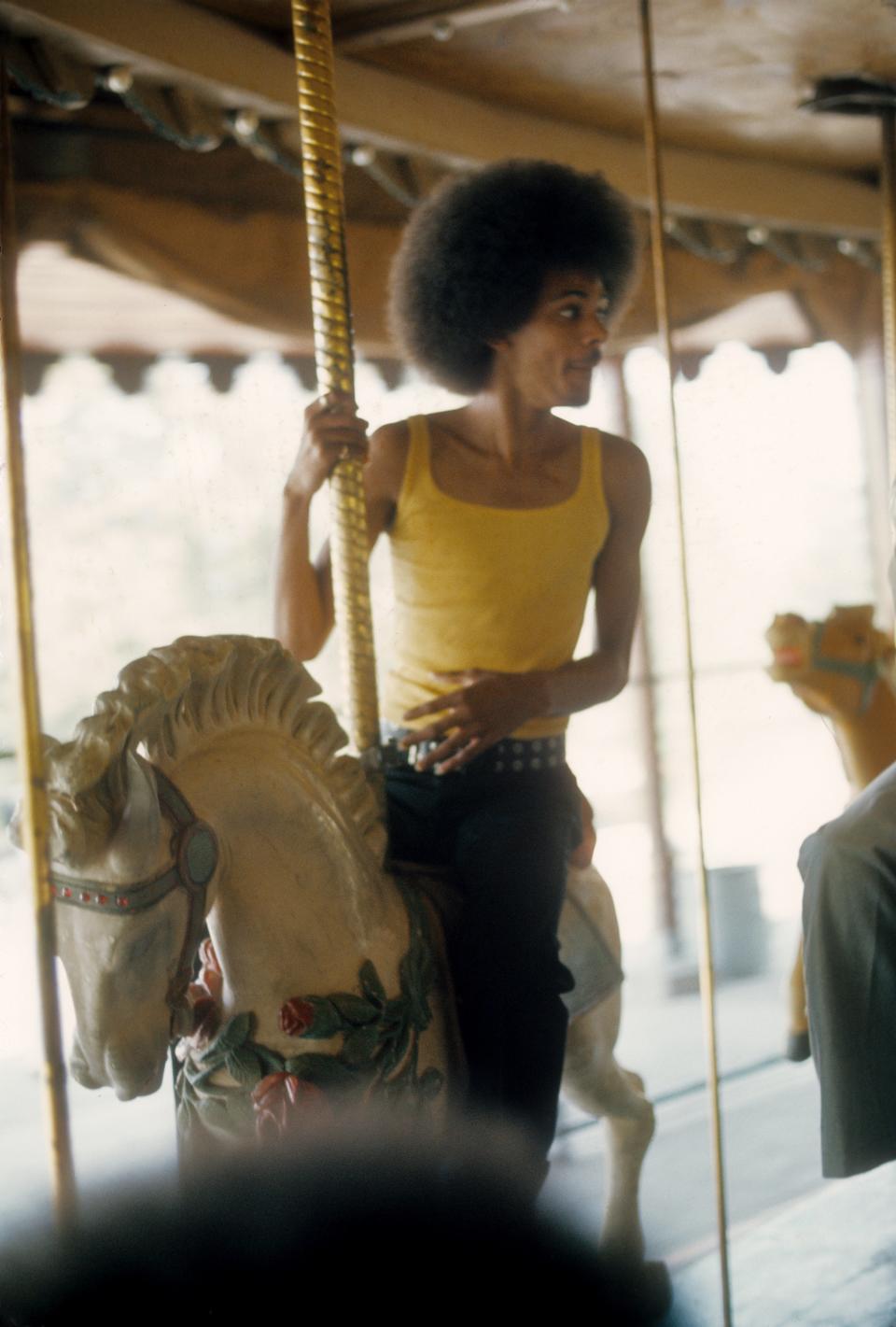 James Sylvers of R&amp;B group The Sylvers rides the carousel at Disneyland in 1973.