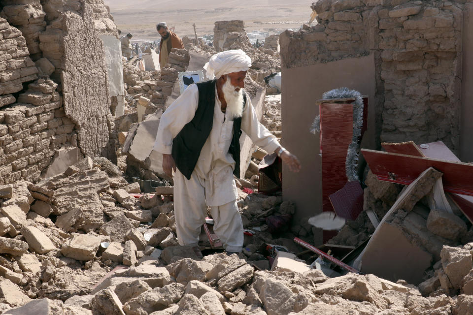 A man cleans up after the earthquake.