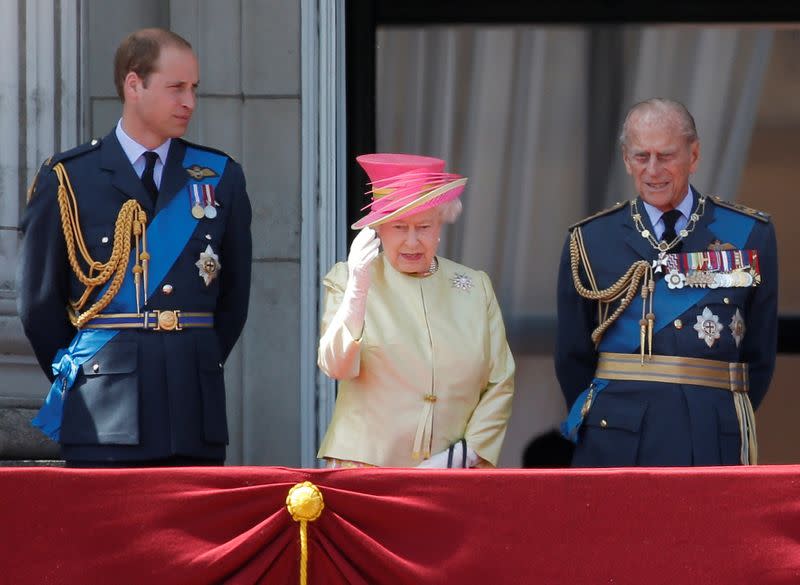 FILE PHOTO: Britain's Queen Elizabeth waves as she stands with Prince William and Prince Philip as as they prepare to view a RAF flypast to mark the 75th anniversary of the Battle of Britain