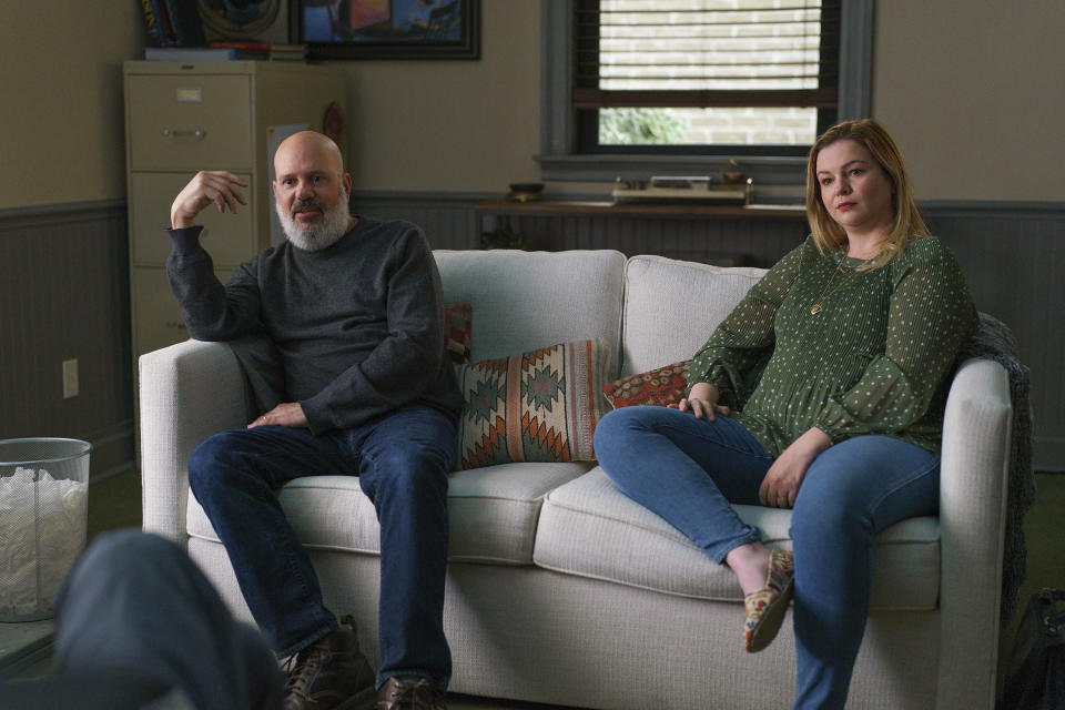 This image released by A24 shows David Cross, left, and Amber Tamblyn in a scene from "You Hurt My Feelings." (Jeong Park/A24 via AP)