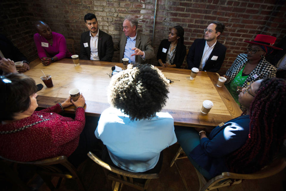 U.S. Sen. Tim Kaine, D-Va., top center, speaks during an economic roundtable with young community leaders, Friday, Jan. 20, 2023, at Front Porch Cafe in Richmond, Va. Kaine, the 2016 Democratic vice presidential nominee and a fixture in Virginia politics for decades, said Friday that he would seek reelection next year, easing his party's worries about holding on to a seat in a state now led by a Republican governor. (AP Photo/John C. Clark)