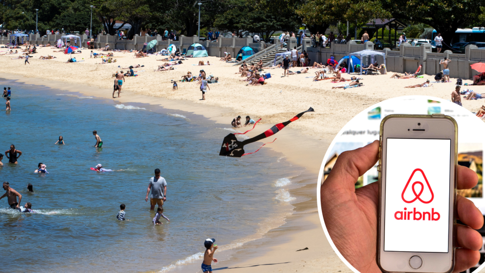 Balmoral Beach in Sydney on a hot day and a person holding a phone with the Airbnb logo.